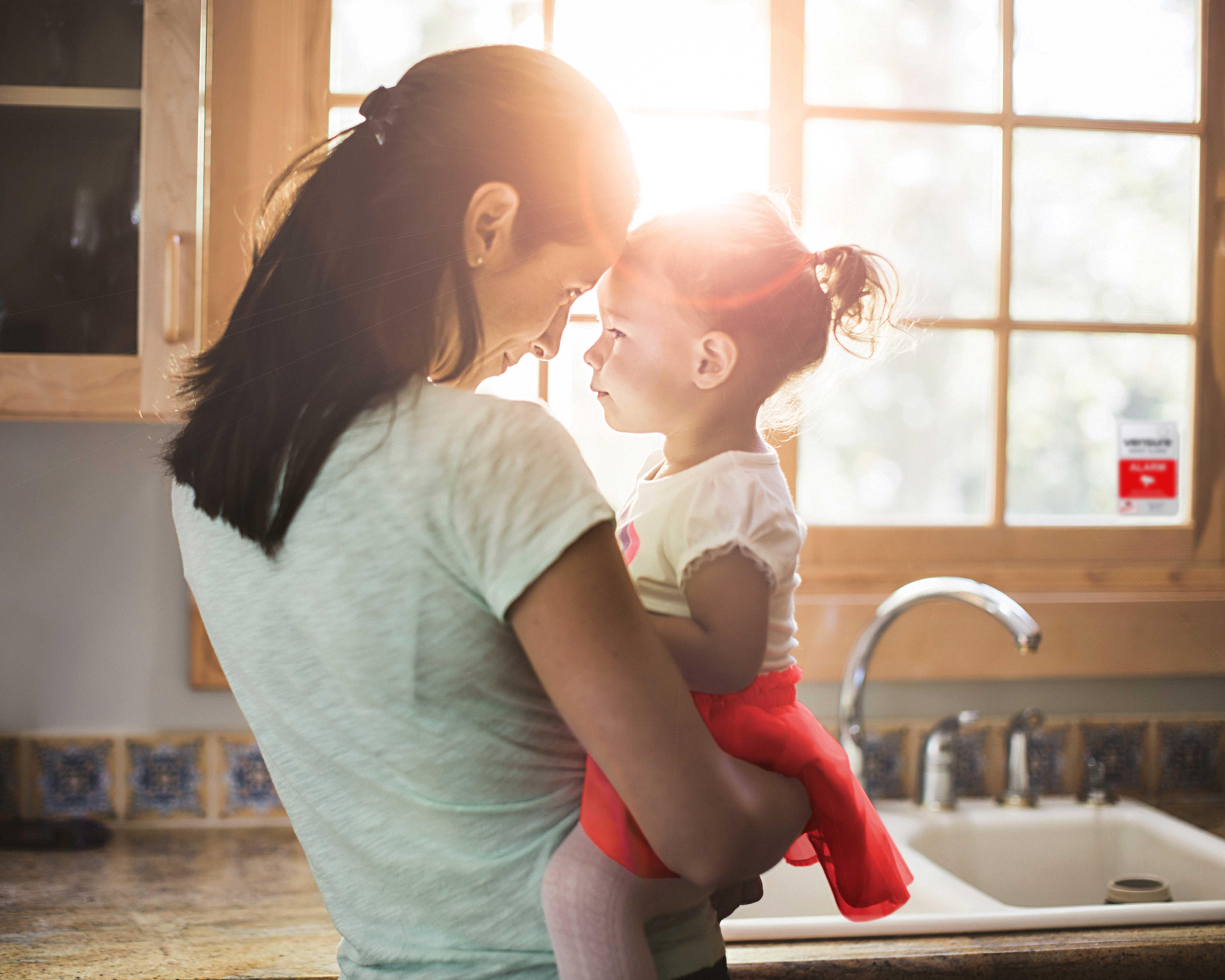 Mother and baby in kitchen