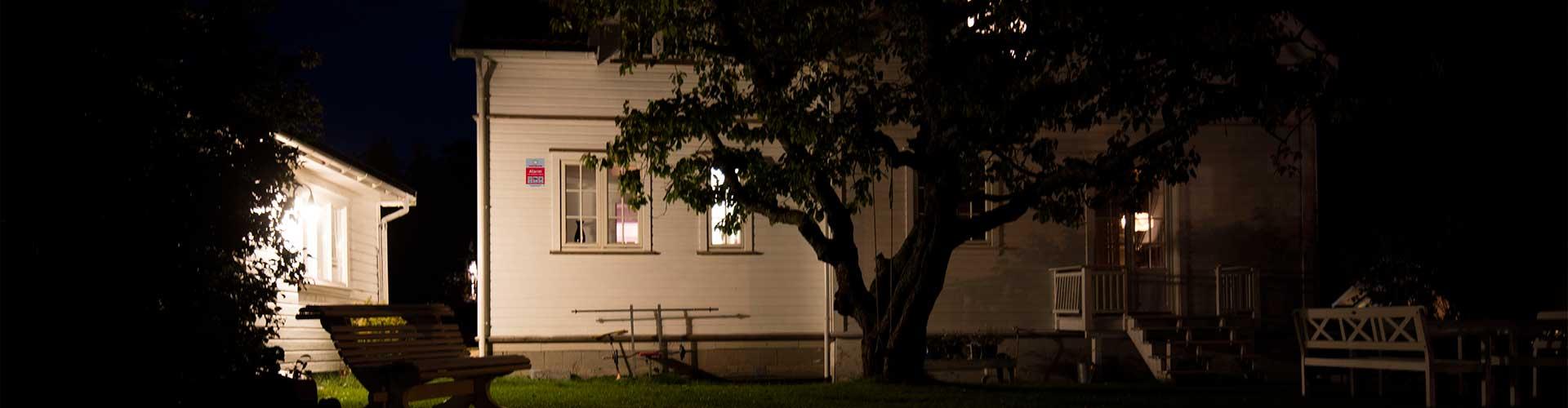 House at night secured with home alarm